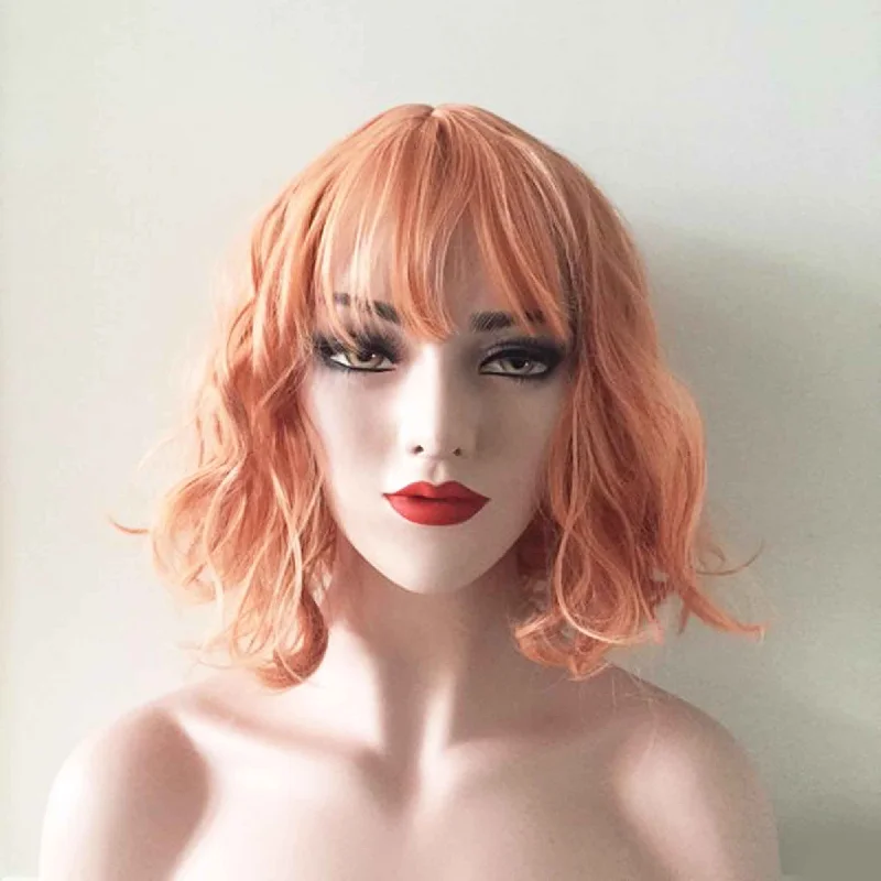 Layered bob wig to add volume and dimensionWomen Orange Short Curly Bob Fringe Bangs Wig